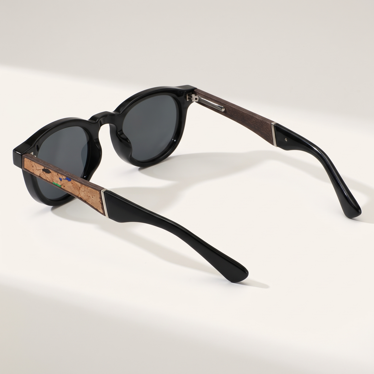 Black | three-quarter view showing the cork temple inlay